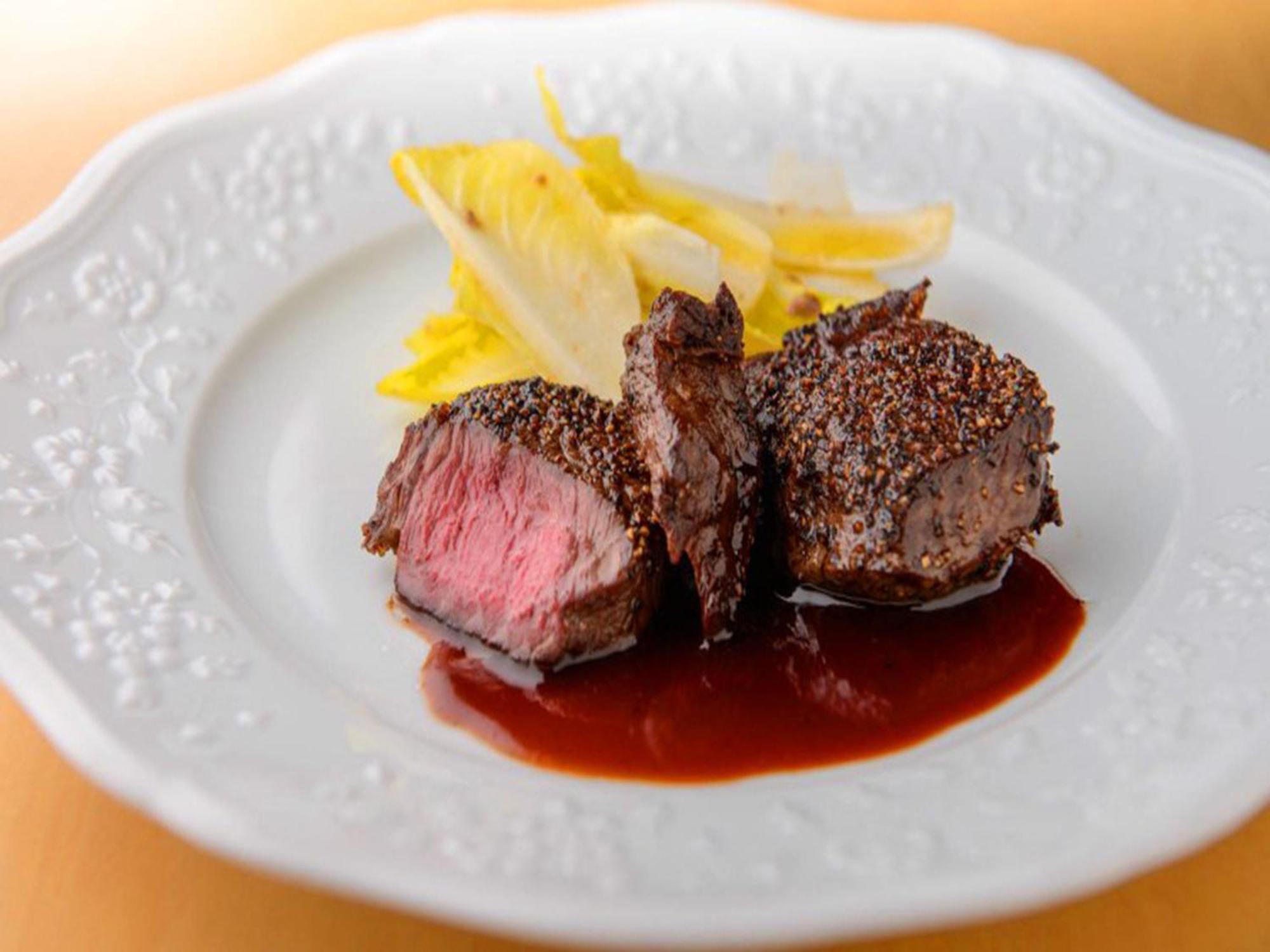 Shin Furano Prince Hotel Bagian luar foto A steak prepared using the dry-aging technique